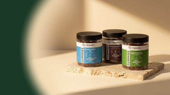 Dr. Herbalist gelatin-free gummy jars: black seed oil, ashwagandha and castor oil gummies on stone surface